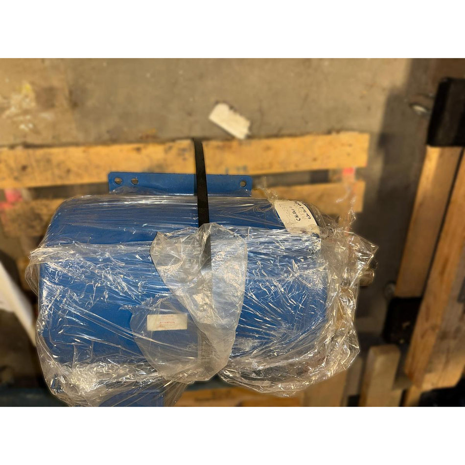 Used Baldor 40 HP three-phase industrial electric motor, model H2539T, frame 324T, wrapped in protective plastic sheeting and secured with a black strap on a wooden pallet in a warehouse setting