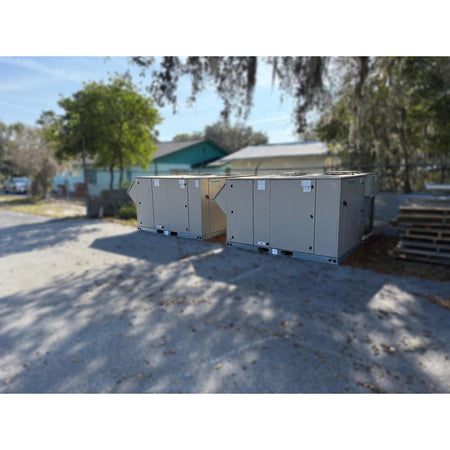 Daikin DPS012AHHE2DW-4 and DPS015AHHE2DW-6 matched pair packaged rooftop HVAC units side by side showing beige powder-coated cabinets and curb mount bases, 2020