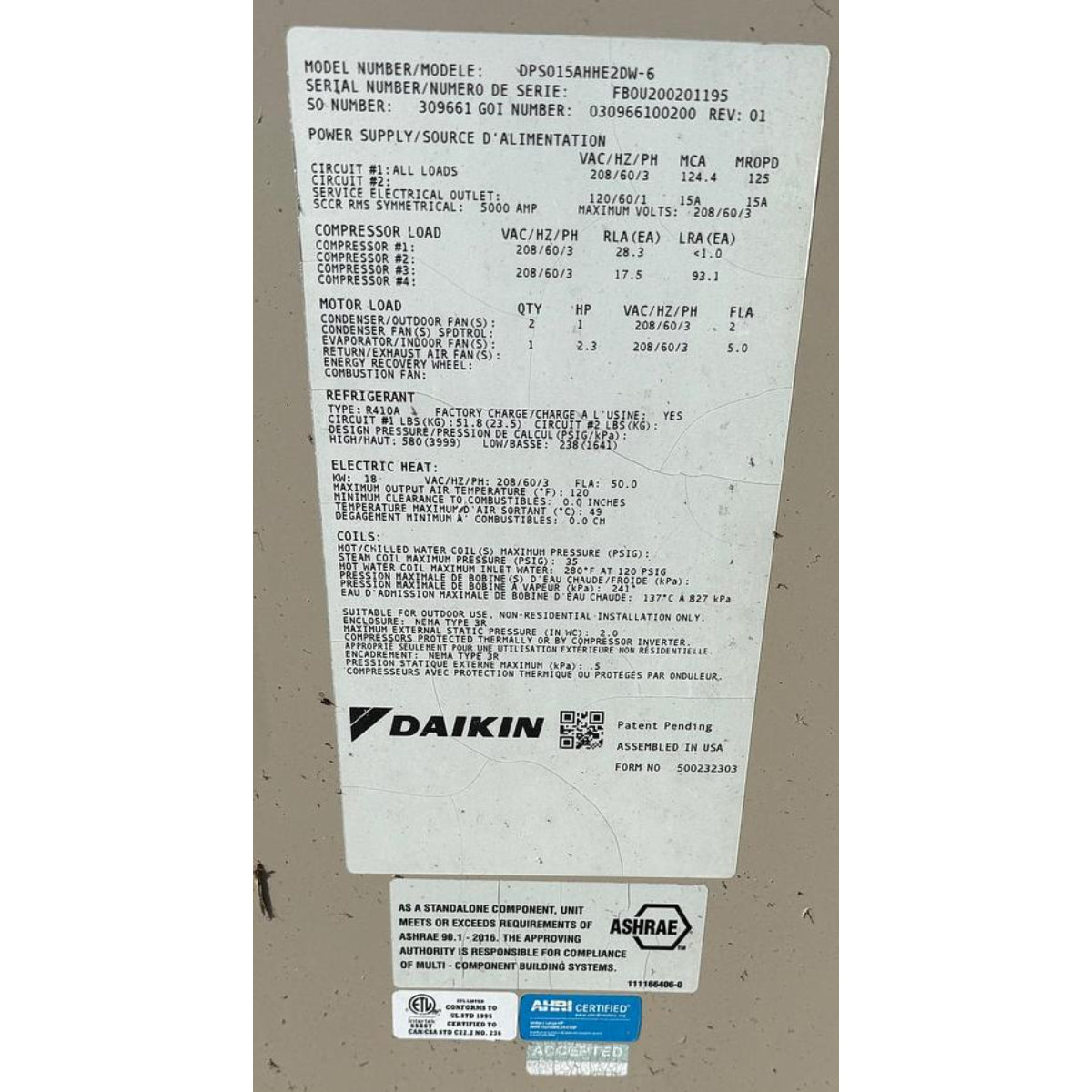 Daikin DPS015AHHE2DW-6 rooftop HVAC unit nameplate showing model, serial number FB0U200201195, 208V/3-phase electrical specs, R410A refrigerant, and ASHRAE 90.1-2016 certification