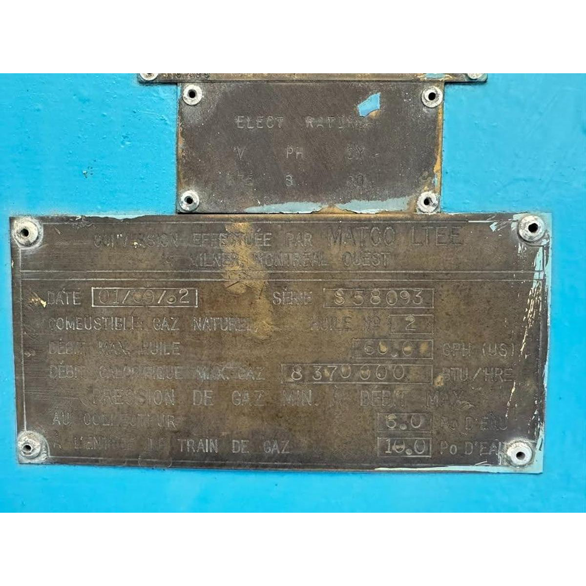 Metal plates with text and numbers on a blue background