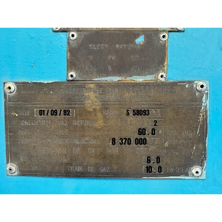 Metal plaque with text and numbers on a blue background