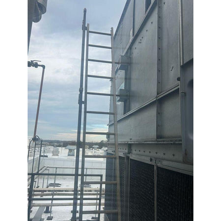 Cooling tower with ladder on a cloudy day