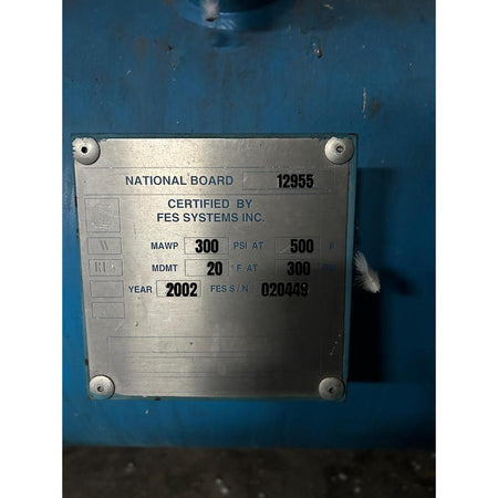 Metal certification plate on a blue background