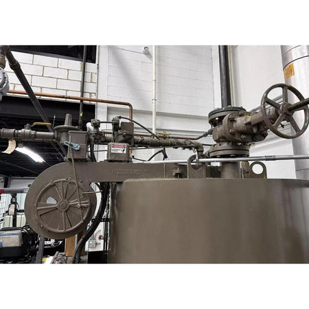 Industrial machine with various components in a workshop setting