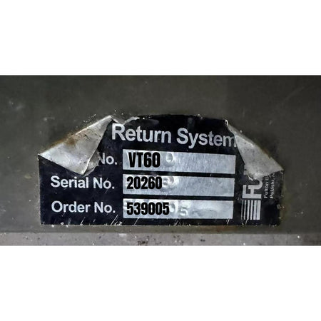 Label with 'Return System' text and serial numbers on a dark background