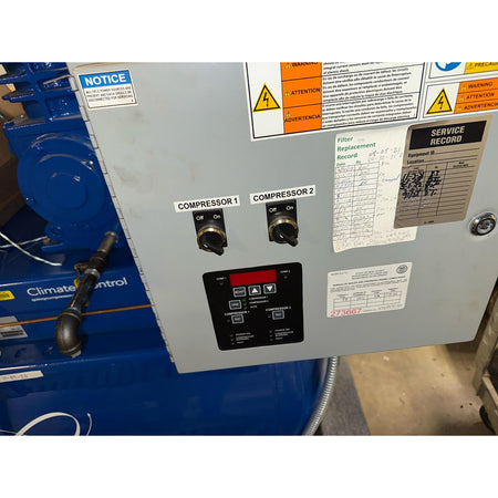 Quincy BMQT7QCBDT Climate Control dual compressor control panel showing Compressor 1 and 2 on/off switches, digital display, filter replacement record, and service record