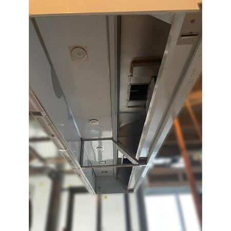 Spring Air KES-ISH commercial kitchen exhaust hood interior view showing integrated lighting fixtures, grease collection plenum, and stainless steel interior construction