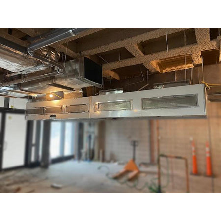 Spring Air KES-ISH multi-section stainless steel commercial kitchen exhaust hood system ceiling-suspended with ductwork connections and grease filter banks