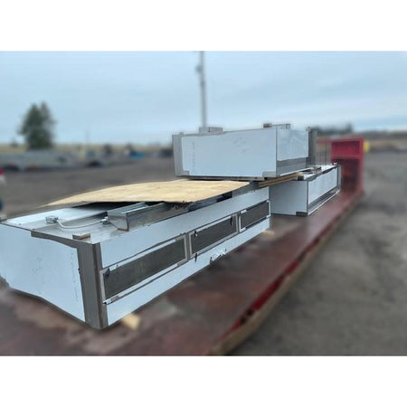 Spring Air KES-ISH stainless steel commercial kitchen exhaust hood sections on flatbed showing grease filter access doors and modular construction detail