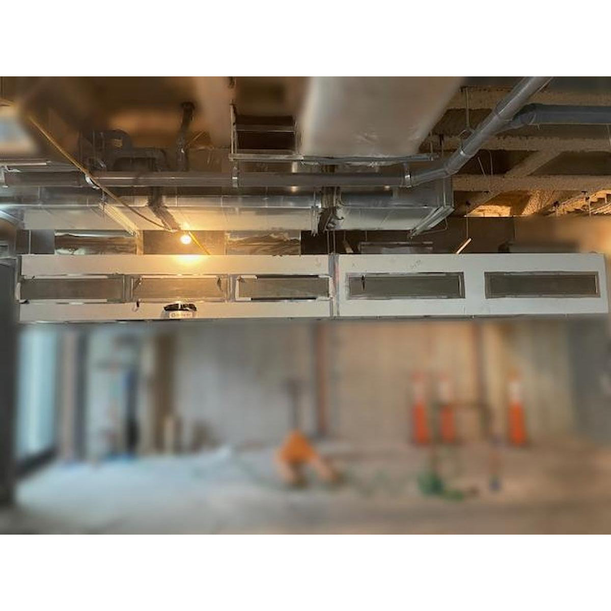 Spring Air KES-ISH commercial kitchen exhaust hood full system view showing multiple hood sections, grease filter banks, integrated lighting, and overhead ductwork connections