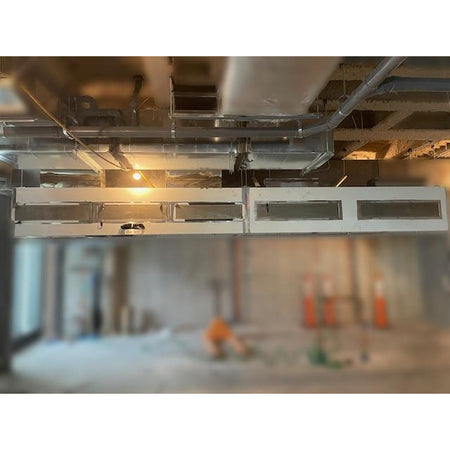 Spring Air KES-ISH commercial kitchen exhaust hood full system view showing multiple hood sections, grease filter banks, integrated lighting, and overhead ductwork connections