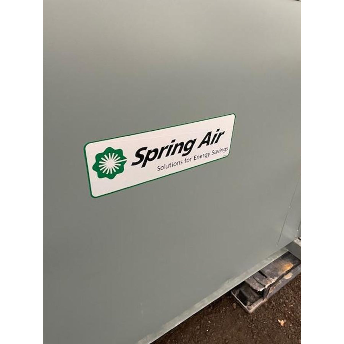 Spring Air Solutions for Energy Savings logo on gray painted roof-mounted exhaust fan housing for KES-ISH commercial kitchen ventilation system