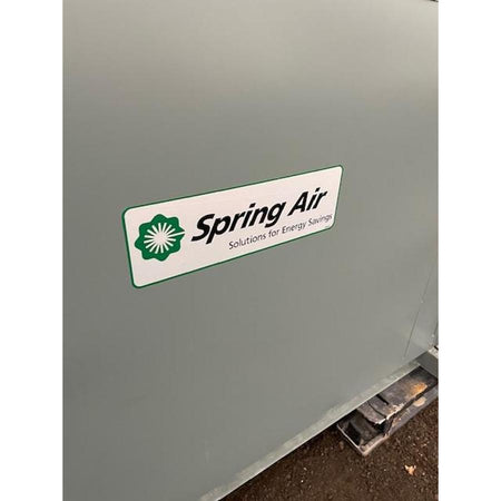Spring Air Solutions for Energy Savings logo on gray painted roof-mounted exhaust fan housing for KES-ISH commercial kitchen ventilation system