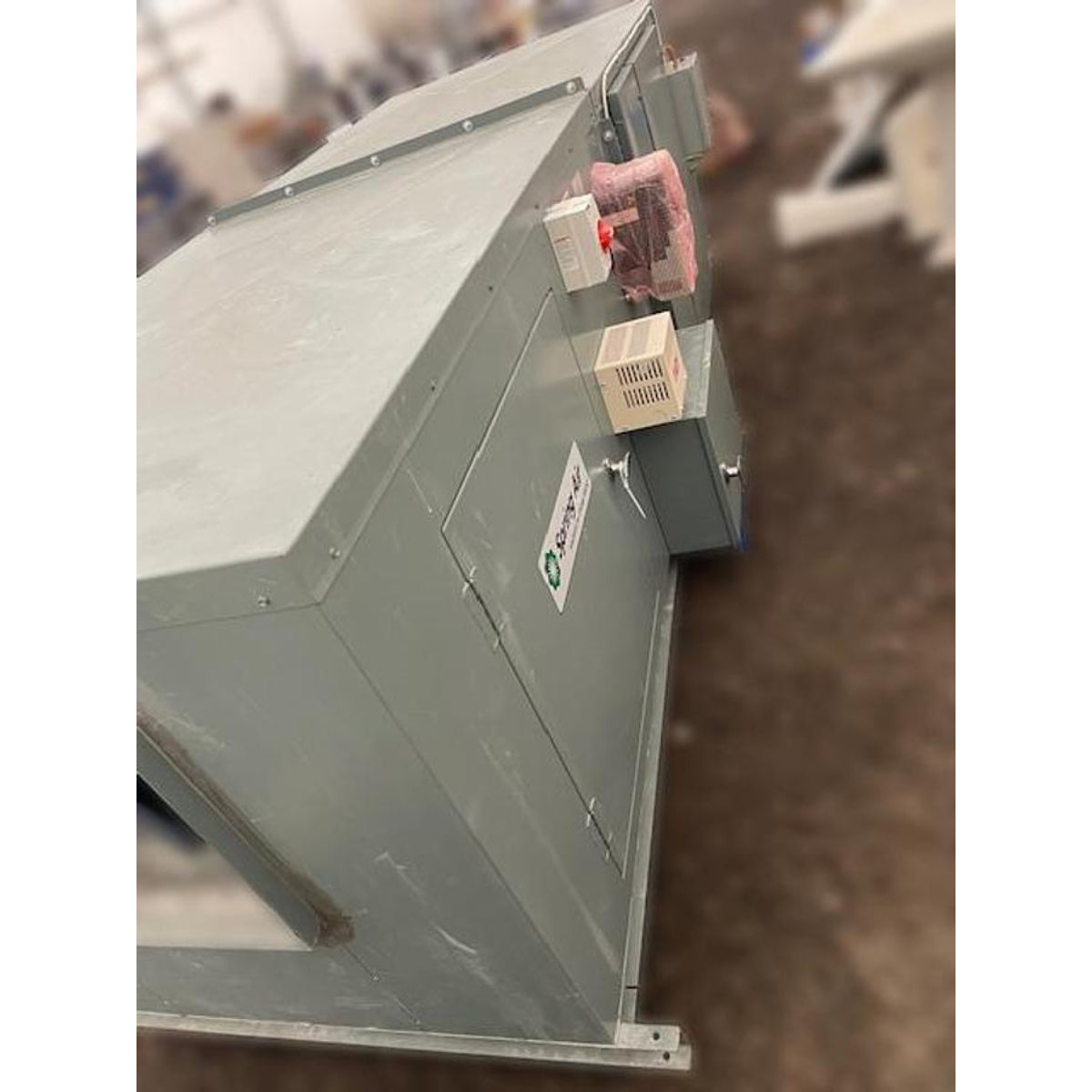 Spring Air KES-ISH roof-mounted exhaust fan housing side view showing gray painted steel construction, electrical junction box, control components, and Spring Air logo